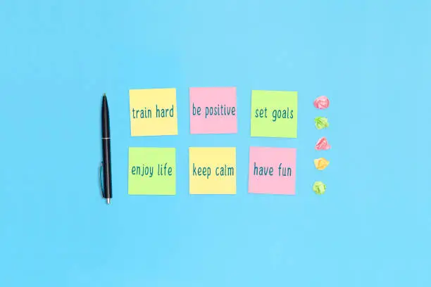 Sticky notes with handwritten motivational inscriptions. Positive affirmations.