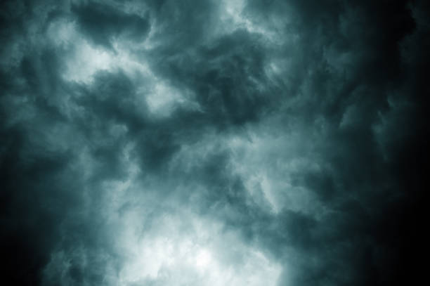 istock Thick dark black storm clouds covering summer sunset sky. Just before gale-speed wind started blowing before Nor'westers Kalbaishakhi Bordoisila thunderstorm torrential rain. Atmospheric background. 1322714569
