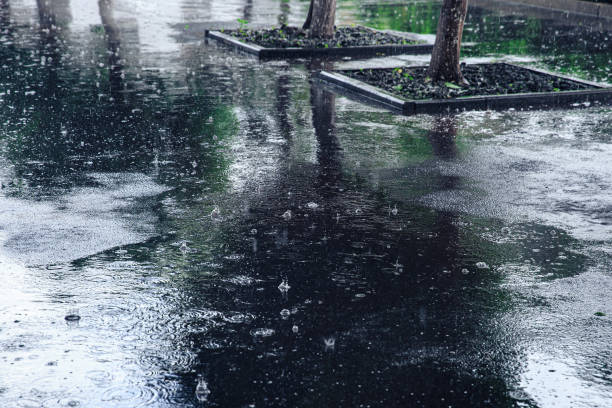 istock Black asphalt in heavy rain 1322715064