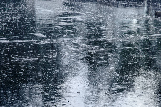 istock Black asphalt in heavy rain 1322715069