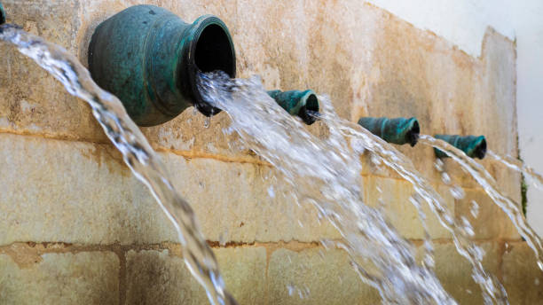 Drinking water source Water jets from a public fountain in Mijas squirting stock pictures, royalty-free photos & images