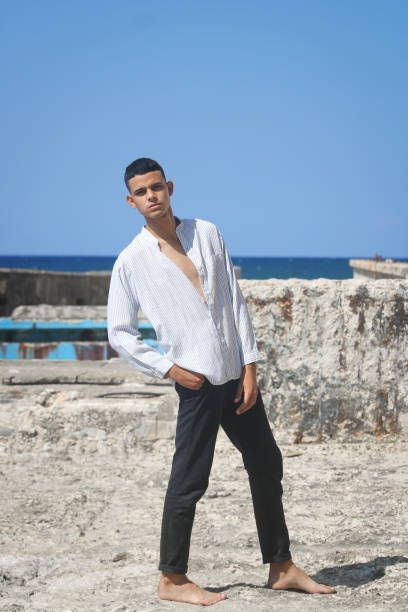 istock A young man poses in an abandoned building and smiles 1322716898