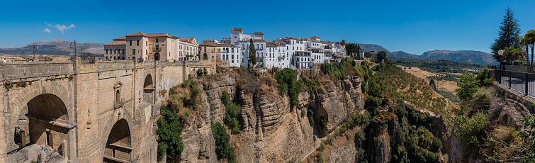 A panorama picture of the town of Ronda, the New Bridge and the El Tajo canyon.