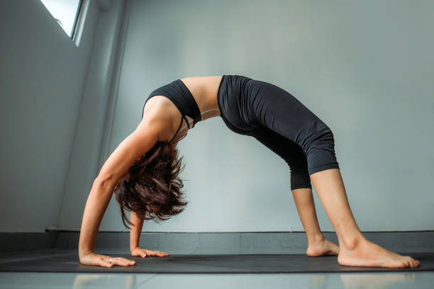 istock Asian chinese beautiful women practicing yoga in office 1322718028