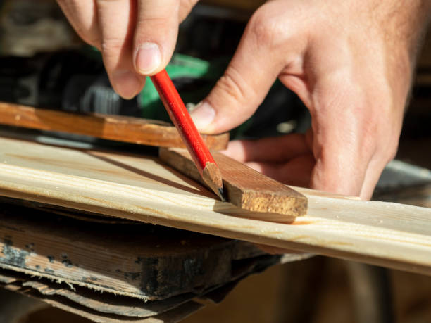 istock the man draws a line with a pencil on the construction Board measuring the desired angle 1322718161