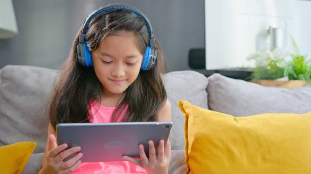 istock Happy and confidence girl student listening online class on digital tablet while homeschooling at home. 1322720579