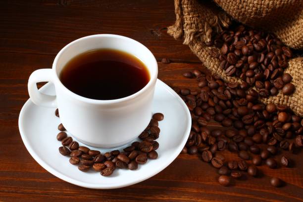 istock Cup of coffee and coffee beans. Beautiful still life 1322722980