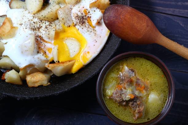 istock Rustic food from simple products. Soup, eggs and wine. 1322723011