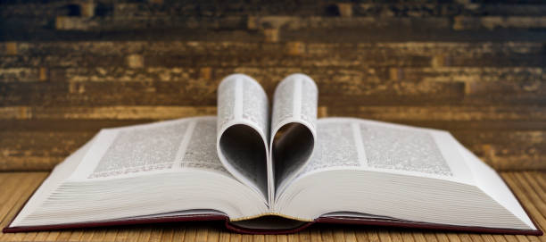 istock The book is on the table. Heart from book pages. 1322723083