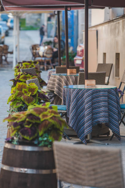 istock empty tables of cafe outdoors 1322723994