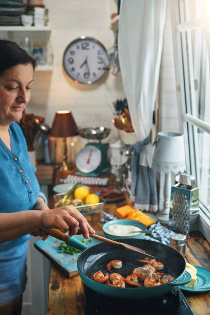 istock Preparing Shrimp and Grits in Domestic Kitchen 1322726178