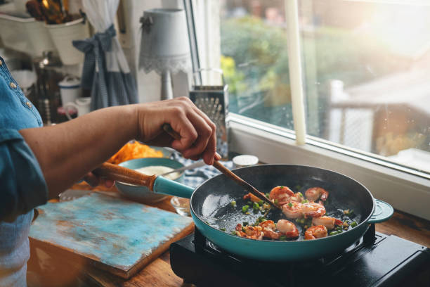 istock Preparing Shrimp and Grits in Domestic Kitchen 1322726209