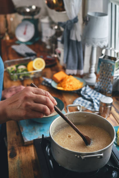 istock Preparing Shrimp and Grits in Domestic Kitchen 1322726314