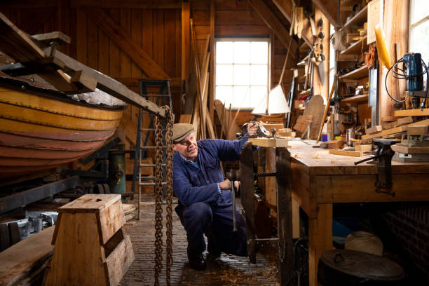 istock senior man working in boat yard 1322728599