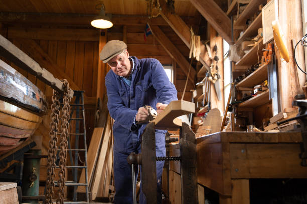 istock carpenter makes part of ship's traditional ship yard 1322728703