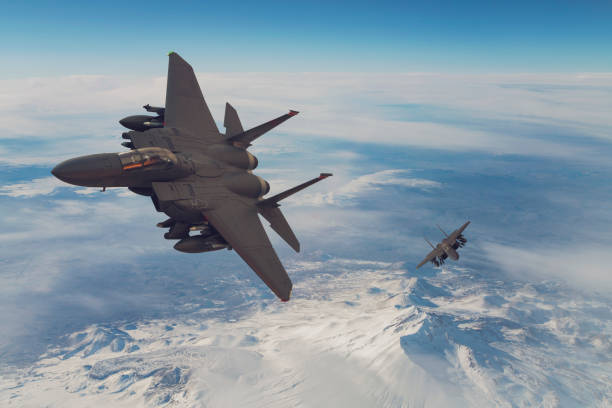 istock Jet fighters flying over snowcapped mountains. 1322729719