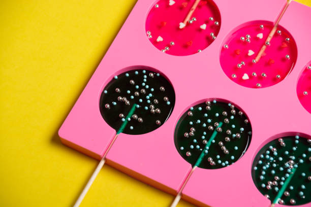 lollipops on a stick in a single form for cooking on a yellow background.