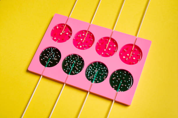 istock lollipops on a stick in a single form for cooking on a yellow background. 1322737251
