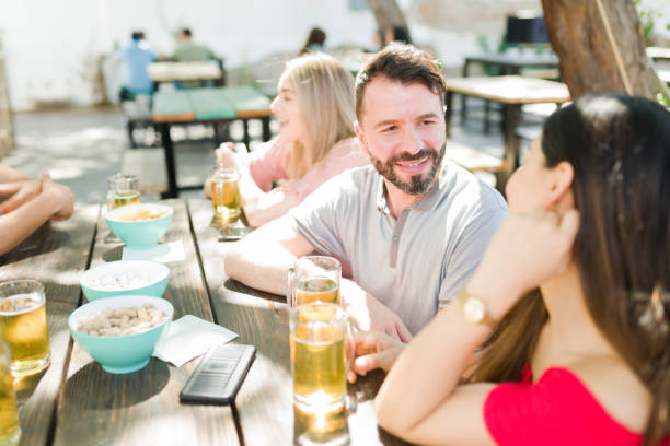istock Hispanic man talking to a woman he likes 1322737382