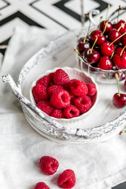 istock Summer fruit Berries in bright kitchen with Raspberries and cherries 1322737627