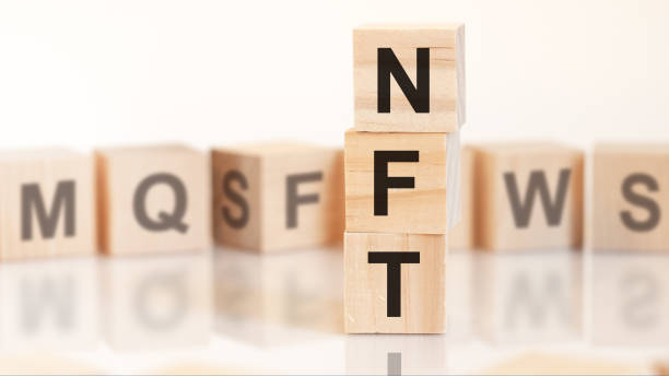 istock word nft from wooden blocks with letters, concept 1322739106