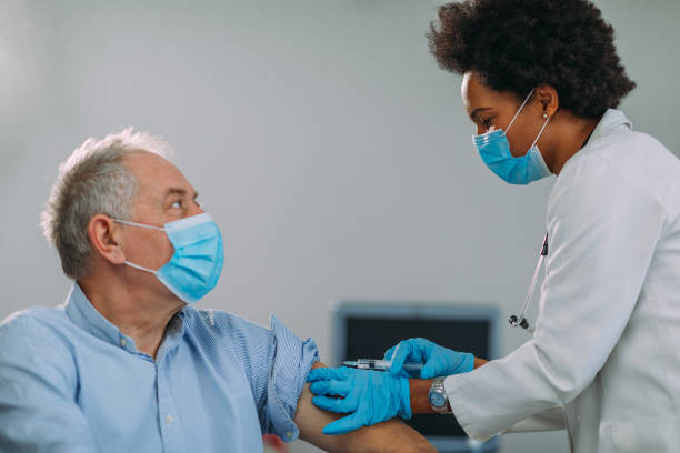 istock Senior man getting vaccinated at hospital 1322739233