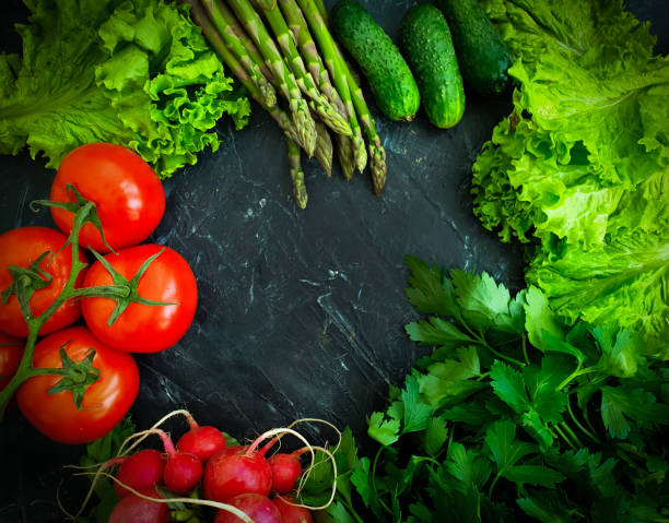 istock fresh vegetables, tomato, cucumber, lettuce, asparagus on a  background 1322740186