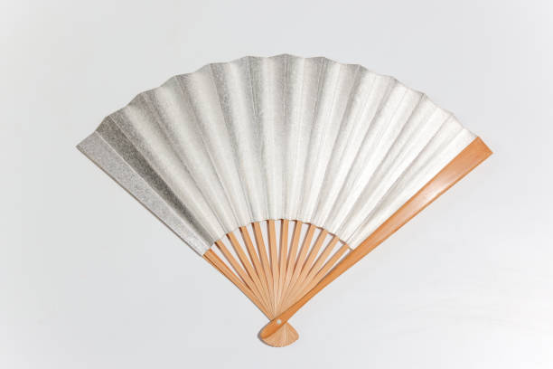 istock silver Japanese fan in a white background 1322742324