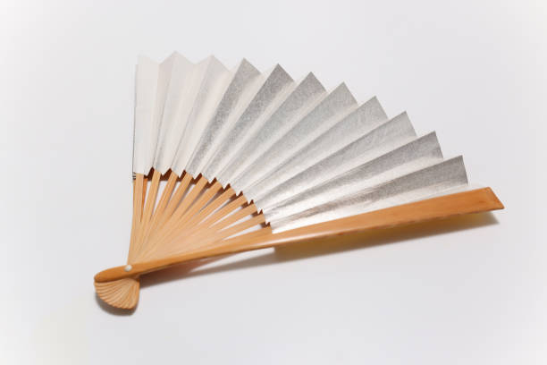 istock silver Japanese fan in a white background 1322742373