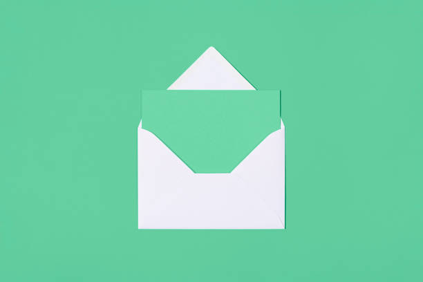 istock Blank mint card with white envelope isolated on mint background. Template or mock up. Banner with copy space 1322745165
