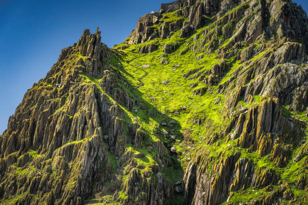 Closeup on steep stairs carved in stone on Skellig Michael island where Star Wars were filmed stock photo