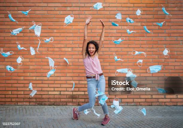 The End Of Quarantine Throwing Masks Celebrating Victory Over Coronavirus Pandemic Stock Photo - Download Image Now