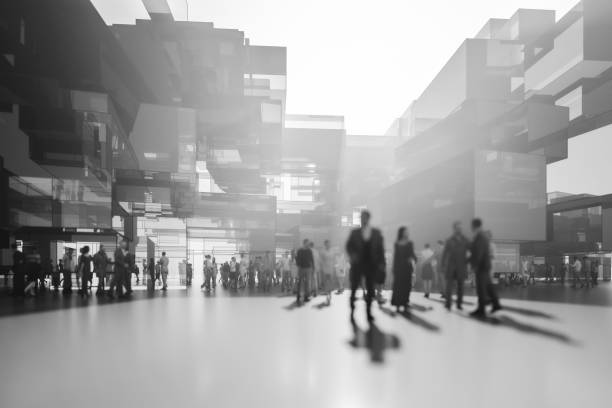 istock Office buildings with business people walking 1322752931