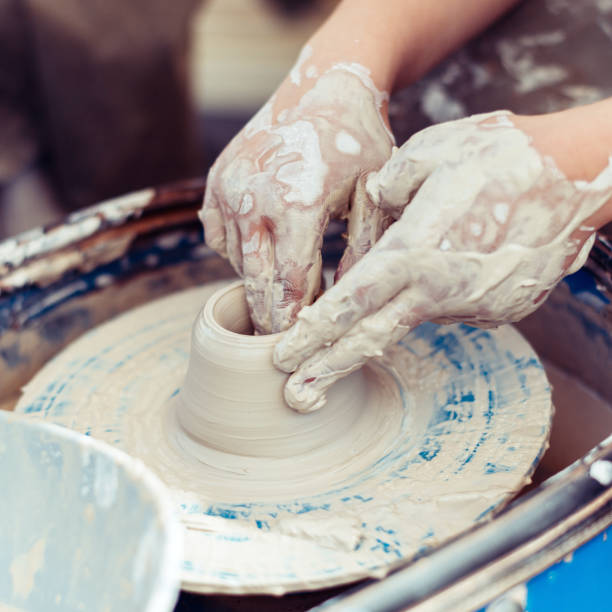 istock Master of pottery creates shapes from clay 1322753145