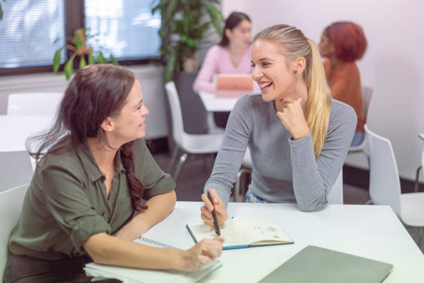 istock University students collaborate together on a team project 1322753234