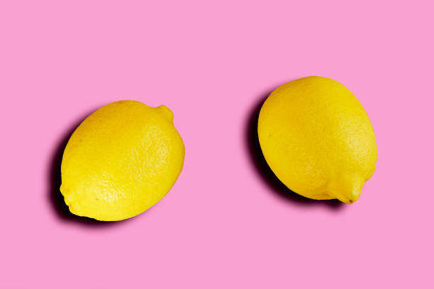 istock Yellow lemon and pink background. 1322755696