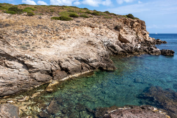 istock Wild Aegean sea with rocky cliffs and blue water 1322755741