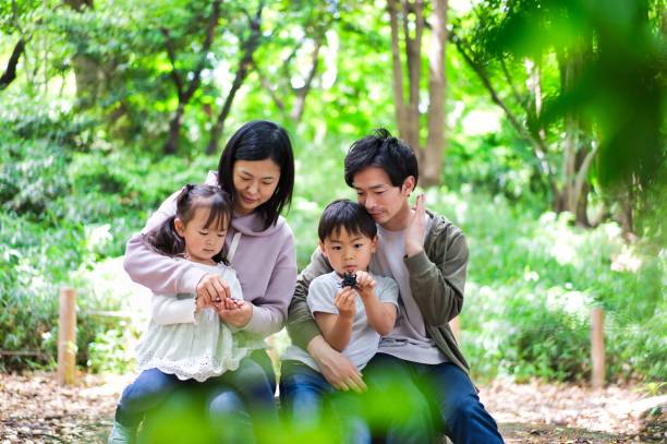 istock A happy family observing insects 1322756880