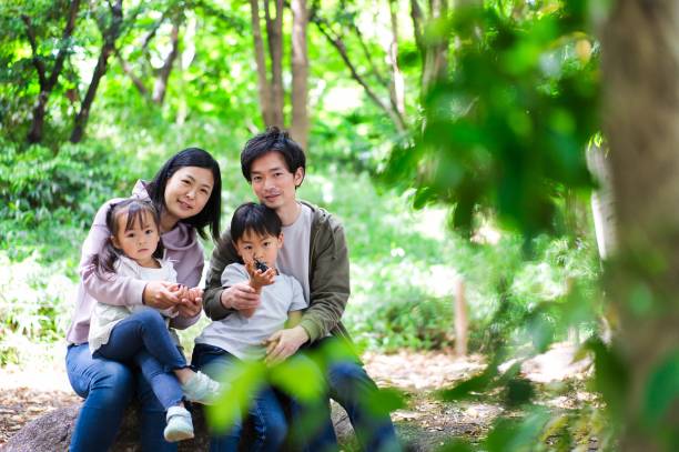 istock A happy family observing insects 1322756888