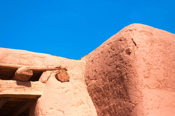 Santa Fe, NM: Old Adobe House Exterior Detail; Blue Background