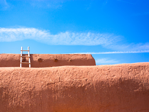 Santa Fe Style: Kiva Ladder Against Adobe Wall, Blue Sky