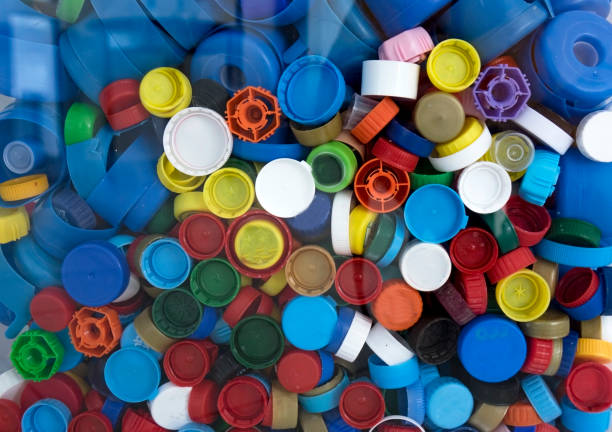 istock Recycling collection and processing of plastic bottle caps. The cover material is recyclable. 1322783080