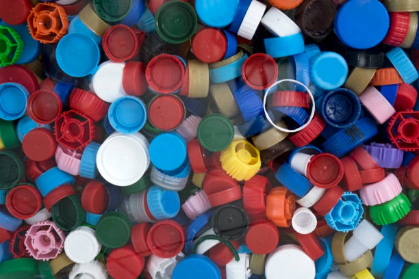 istock Recycling collection and processing of plastic bottle caps. The cover material is recyclable. 1322783120