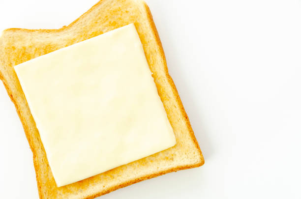 slices of cheese on toast isolated on white background