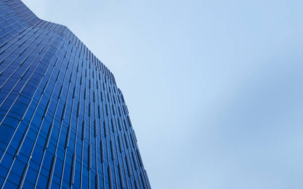 istock A top of blue office building in cloudy afternoon 1322786977