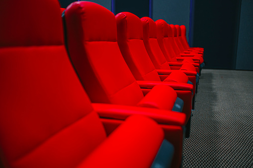 lonely red chair in a concrete room. 3d render