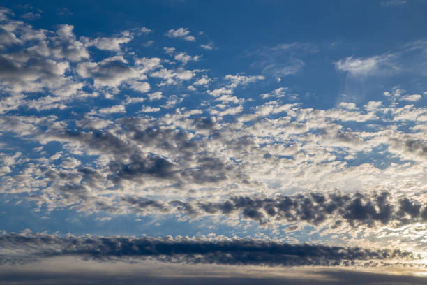 istock Beautiful blue sky with white cirrus clouds at sunset. 1322790745
