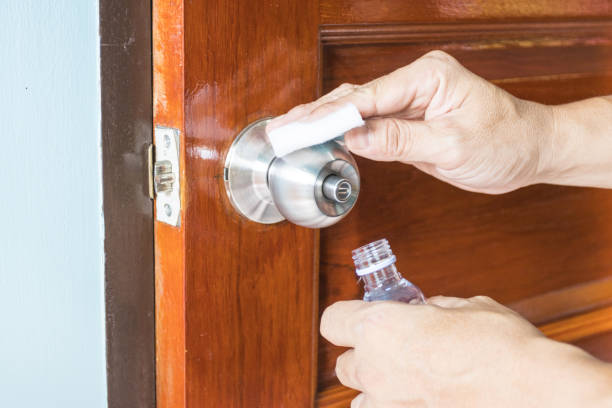istock Prevention cleaning Door handles by Disinfectant solution for killing corona virus on touching surfaces, concept coronavirus COVID19 1322794905