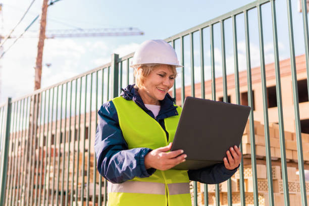 istock A woman Builder at a construction site inspects a building 1322797912