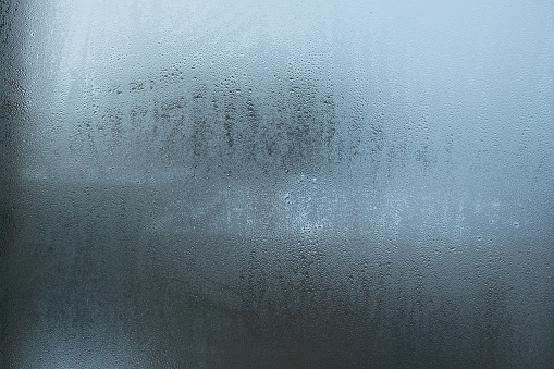 Frozen raindrops on the window pane. Texture